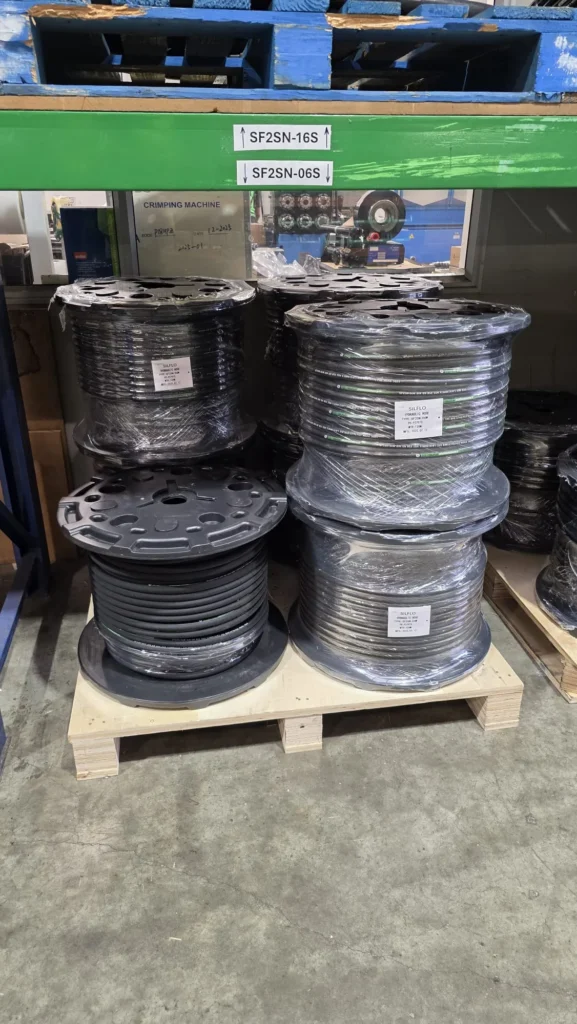 Heavy hydraulic hose rolls for smart inventory container storage